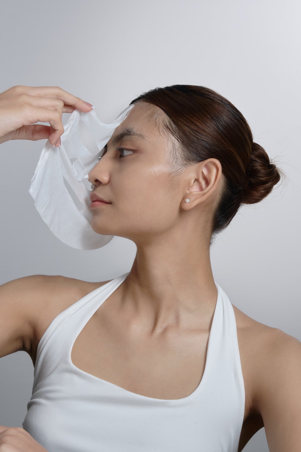 Woman with glowing skin using CLEF skincare